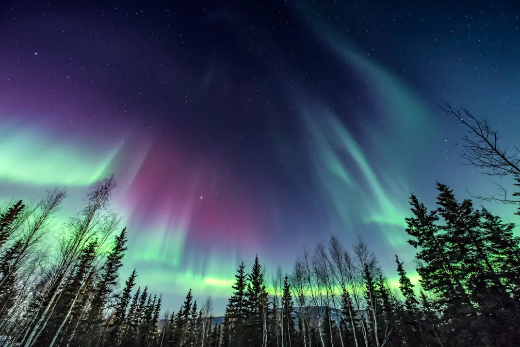 Norther lights colors  blue, purple, maroon, green and other hues paint the night sky