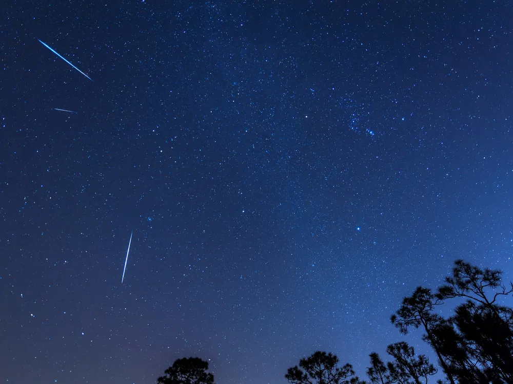 Shooting star in dark sky